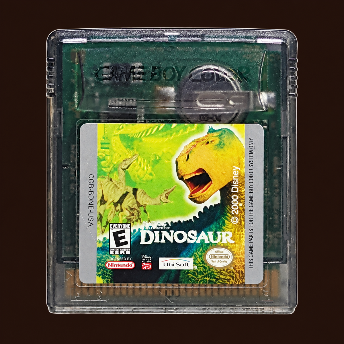 Disney's Dinosaur Game Boy Color cartridge — dark brown background with a fine light outline